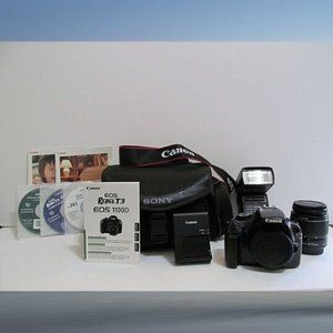 CANON EOS REBEL T3 EOS 1100D BUNDLE CHARGER, BATTERY, LENS, FLASH, CD'S, BOOKLET